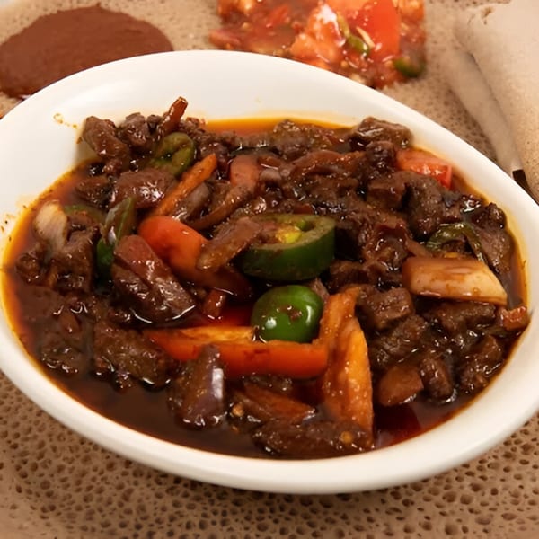 Rohobot Ethiopian Restaurant's Kitfo, a dish of minced beef, chili, and spices, served with injera.