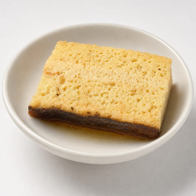 Caramel Tres Leches Bar Cake Slice.
